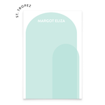 A notepad with text that reads "Margot Eliza" and an illustration of two light blue arches overlapping