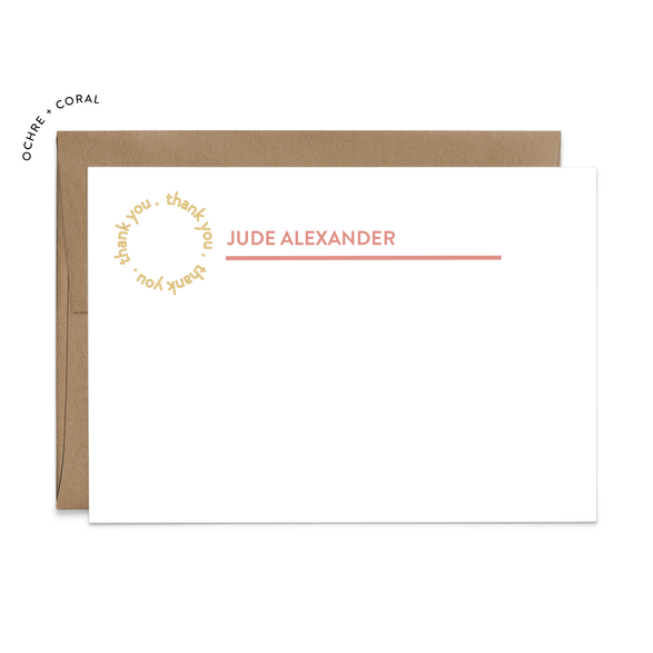 Image of a white flat note card and a kraft brown envelope. The card has the words “thank you” repeating in a circle shape in the top left corner and an example of a name with a line beneath the name.