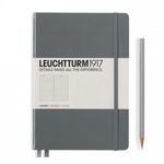 An image of a grey Leuchtturm notebook with lined paper and a silver pencil