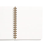 An image of an open notebook with lined paper inside and gold spiral binding