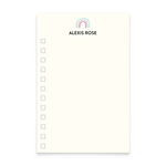 A photo of a notepad with a rainbow illustration and text that reads "Alexis Rose" at the top with check boxes down the left side