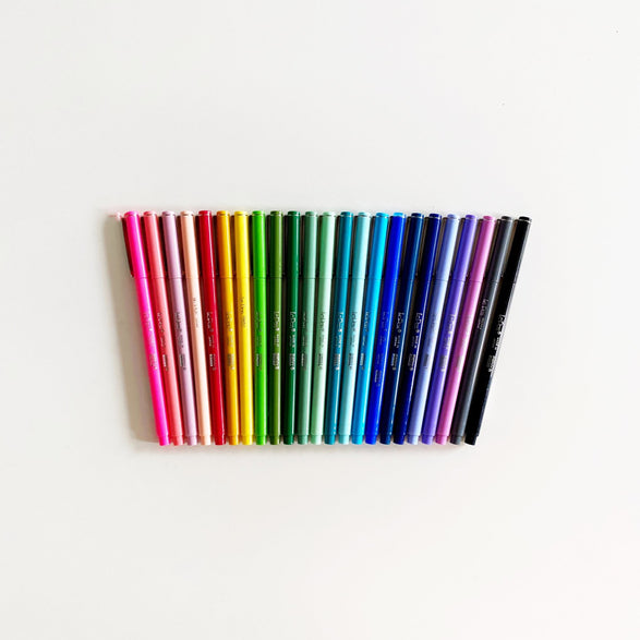 An image of a group of le pens organized in a rainbow