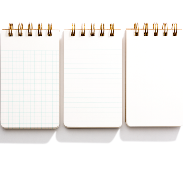 An image of three open small reporter notebooks with graph, lined and blank paper